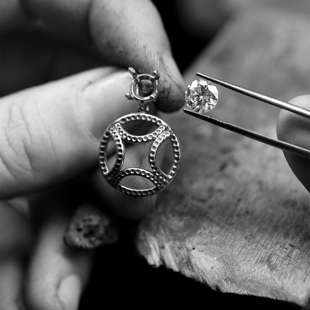 Artisanal setting of colorless lab-grown diamonds on ethical recycled 18k gold jewelry